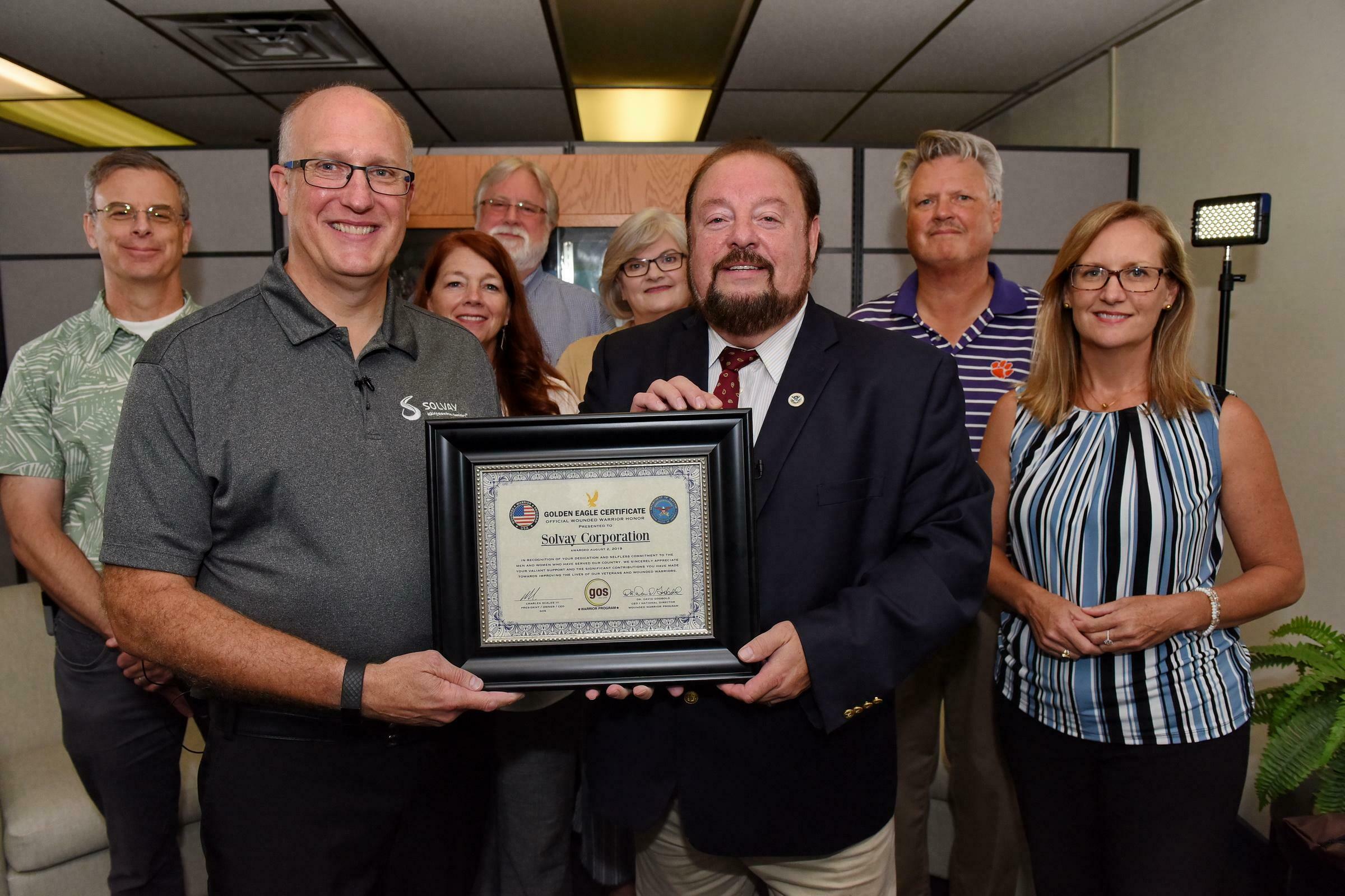 Solvey Golden Eagle dr godbold presenting award to solvey corp